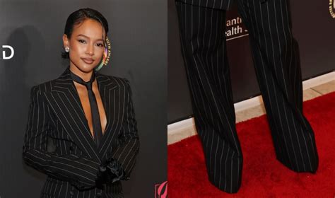 Karrueche Tran Wears Hidden Shoes & Striped Pant Suit to The 